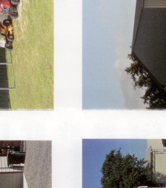 A-frame vertical metal carport with white truck parked underneath