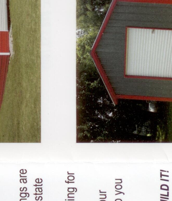 Tan metal commercial storage building on concrete slab